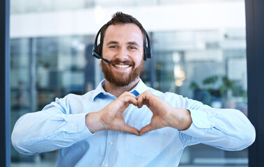 Callcenter agent, man with smile and heart hands in portrait, love customer service job and...