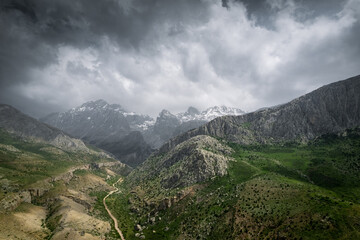 Aladaglar General view during spring, green grass and snowy peaks, mountain range in central...