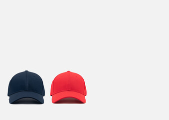 two baseball caps on a light background with space for text