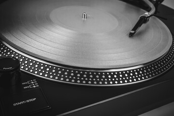 Turntable vinyl record player close up. Retro style toned image