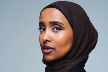 Beautiful arab middle-eastern woman with traditional abaya in studio