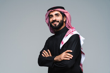 Handsome saudi arabian middle-eastern man with traditional thwab portrait in studio