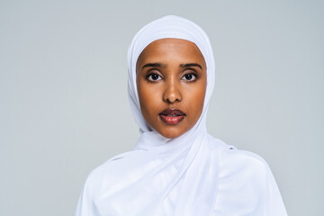 Beautiful arab middle-eastern woman with traditional abaya in studio