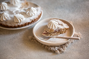 Appetizing beautiful cupcake with meringue, beautiful still life with delicious cake on the table. Sweet delicacy berry pudding in a candy store. beautiful food