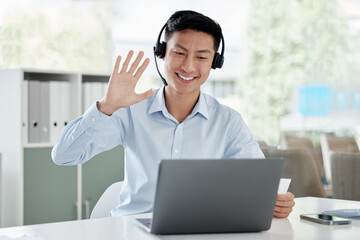 Asian man, laptop and video call in call center, customer service or virtual assistant at the...