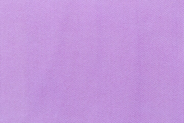The light purple background from a textile material. Fabric with natural texture.