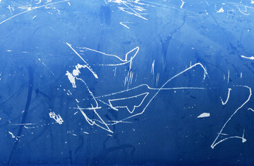 Blue old boat hull painting with scratches