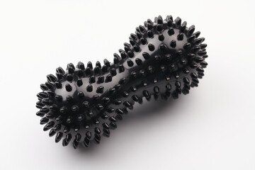 Black ball for relaxing muscle massage isolated on white background. Myofascial release inventory. Sports and recovery, yoga, self-massage concept