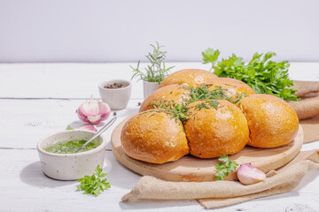 Aromatic garlic buns. Fresh baked goods, a traditional gluten-free soup snack. Parsley, spices