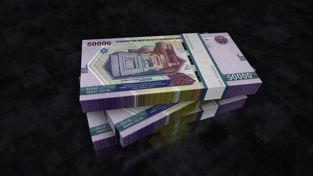 Uzbekistan money Uzbek Sum money pile pack. Concept background of economy, banking, business, crisis, recession, debt and finance. 50000 UZS banknotes stacks 3d animation.
