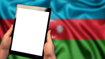 Man hold tablet phone pc gadget with white blank screen, copy space for text, image or message. Flag of Azerbaijan country on background. Technology, information, business
