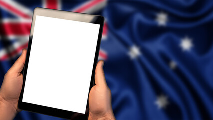 Man hold tablet phone pc gadget with white blank screen, copy space for text, image or message. Flag of Australia country on background. Technology, information, business 