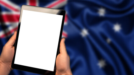 Man hold tablet phone pc gadget with white blank screen, copy space for text, image or message. Flag of Australia country on background. Technology, information, business
