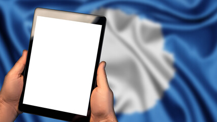 Man hold tablet phone pc gadget with white blank screen, copy space for text, image or message. Flag of Antarctica country on background. Technology, information, business

