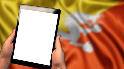 Man hold tablet phone pc gadget with white blank screen, copy space for text, image or message. Flag of Bhutan country on background. Technology, information, business

