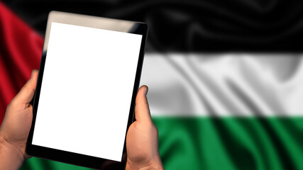 Man hold tablet phone pc gadget with white blank screen, copy space for text, image or message. Flag of Palestine country on background. Technology, information, business 