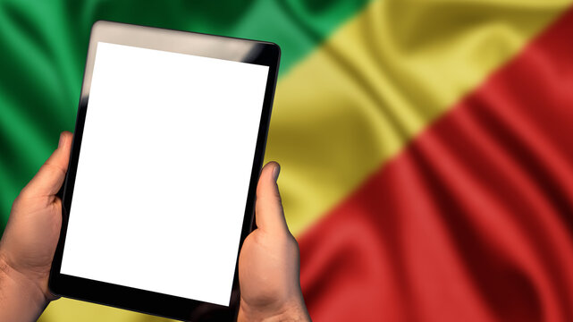 Man hold tablet phone pc gadget with white blank screen, copy space for text, image or message. Flag of Republic of the Congo country on background. Technology, information, business
