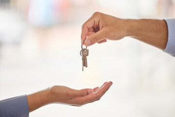 Hands, realtor and agent giving keys to customer after moving into new home. Property, real estate...