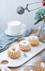 A cup of milk and handmade muffins. Baking with sugar