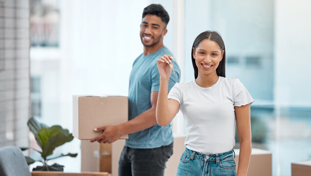 Box, keys and portrait of couple in new home excited for property, apartment and real estate investment. Relationship, moving day and man and woman with key and boxes for relocation, move and house