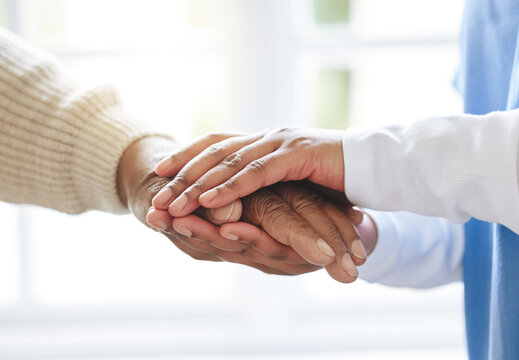 Holding hands, senior patient and nurse for support, healthcare or empathy at nursing home. Elderly person and caregiver together for trust, homecare and counseling or help for health in retirement