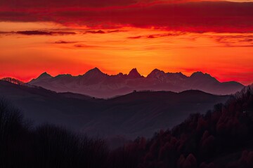 Obraz premium majestic mountain range, with orange and red sky silhouetting the peaks, created with generative ai