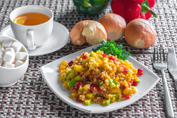 Food vegetable salad with corn and bell pepper with some tea and vegetables near on fabric background