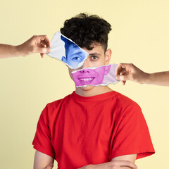 Combination of happiness and sadness. Young man with photo face parts expressing different...