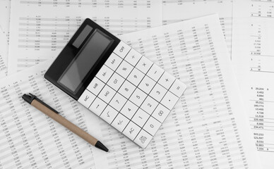 Naklejka na ściany i meble Calculator with pen on financial statement.