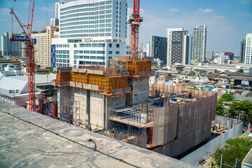 Construction site building crane high rise office building in city