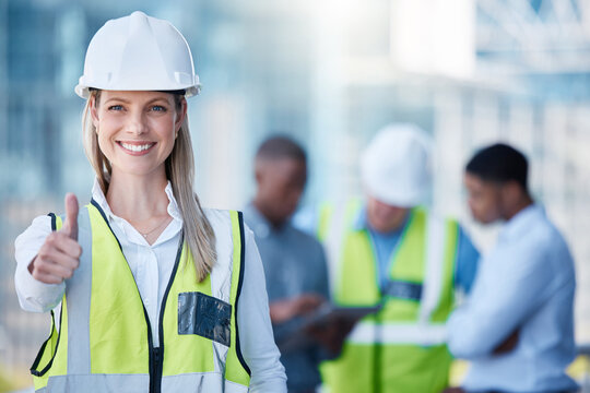 Portrait, thumbs up and a woman construction worker outdoor on a building site with her team in the background. Management, thank you and support with a happy female architect outside for motivation