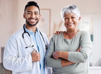 Happy portrait, doctor and senior patient for healthcare, retirement wellness and hospital service. Smile, face and Biracial elderly woman with medical professional, worker or asian person for health