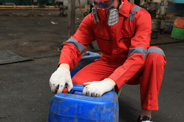 Worker maintenance  or scientist industry wearing protective safety uniform, white glove and gas...