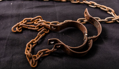 Old chains or handcuffs used to hold prisoners or slaves