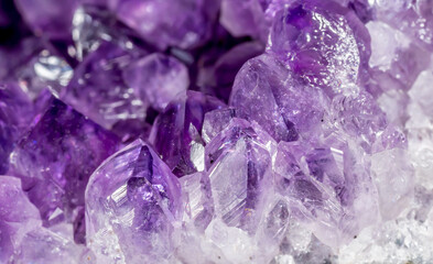 Amethyst purple crystals. Gems. Mineral crystals in the natural environment. Texture of precious...
