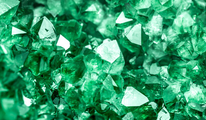 Green crystal mineral stone. Gems. Mineral crystals in the natural environment. Texture of precious...