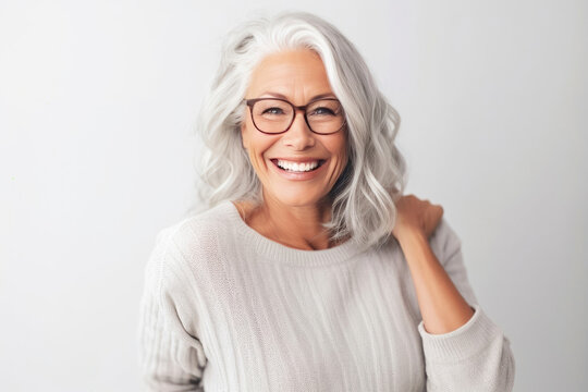 Portrait of senior woman - Graceful Maturity: Lifestyle Portrait of a Pleased Woman in her 60s Wearing Glasses and a Cozy Sweater. Generative AI.