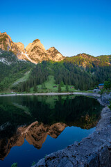 Dawn on the Alpine lake.