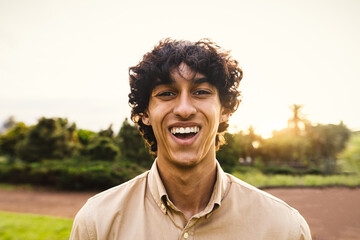 Happy young teenager smiling in front of camera