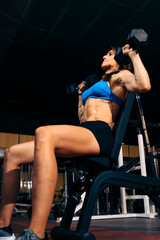 Fototapeta na wymiar Woman Personal Trainer. Strength Unleashed: Middle-Aged Female Trainer's Impact on Fitness Journey