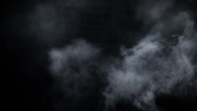 Immersive mesmerising spooky Halloween smoke cloud VFX insert element in 4k slow-motion. A captivating, ethereal swirling, mysterious atmosphere, cloudy mist fog. 