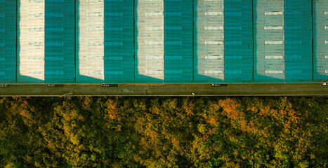 Aerial View WAREHOUSE and trucks vs nature background