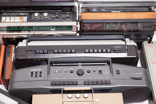 Collection of old tape recorders and transistor radio