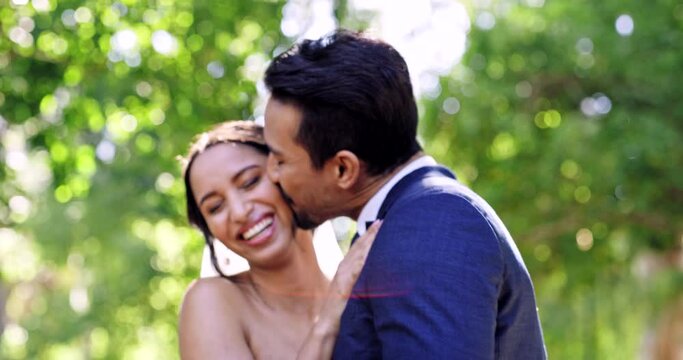 Wedding, couple and laughing in park, kiss and support of celebration, bridal union and marriage event. Happy bride, groom and smile in garden for love, hug and celebrate commitment together outdoor