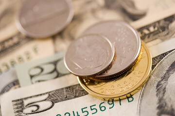 Euro and 1 dollar coins working as gears