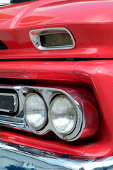 Front detail of red American pickup truck from the sixties - obrazy, fototapety, plakaty