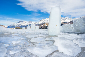Winter scene at Resia Lake  with sunken gray steeple. Resia Lake is an artificial lake located in the western portion of South Tyrol, Italy, near the Resia Pass.