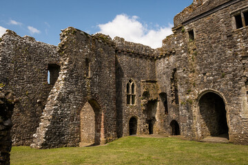 Fototapeta na wymiar Remains of Weobley castle on the gower peninsula south wales UK. Historical British building in beautiful nature landscape on sunny summer day. History landmark for outdoor lifestyle tourists