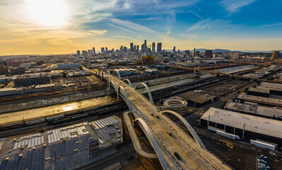 New 6th Street bridge in Los Angeles at sunset with the Los Angles skyline. Beautiful view of LA...