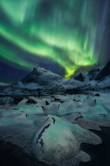 Aurora Borealis over the ice formation known as alien eggs, Uttakleiv beach, Lofoten and Vesteral...